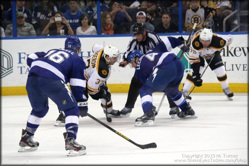 Boston and Tampa faceoff to win possession of the puck.